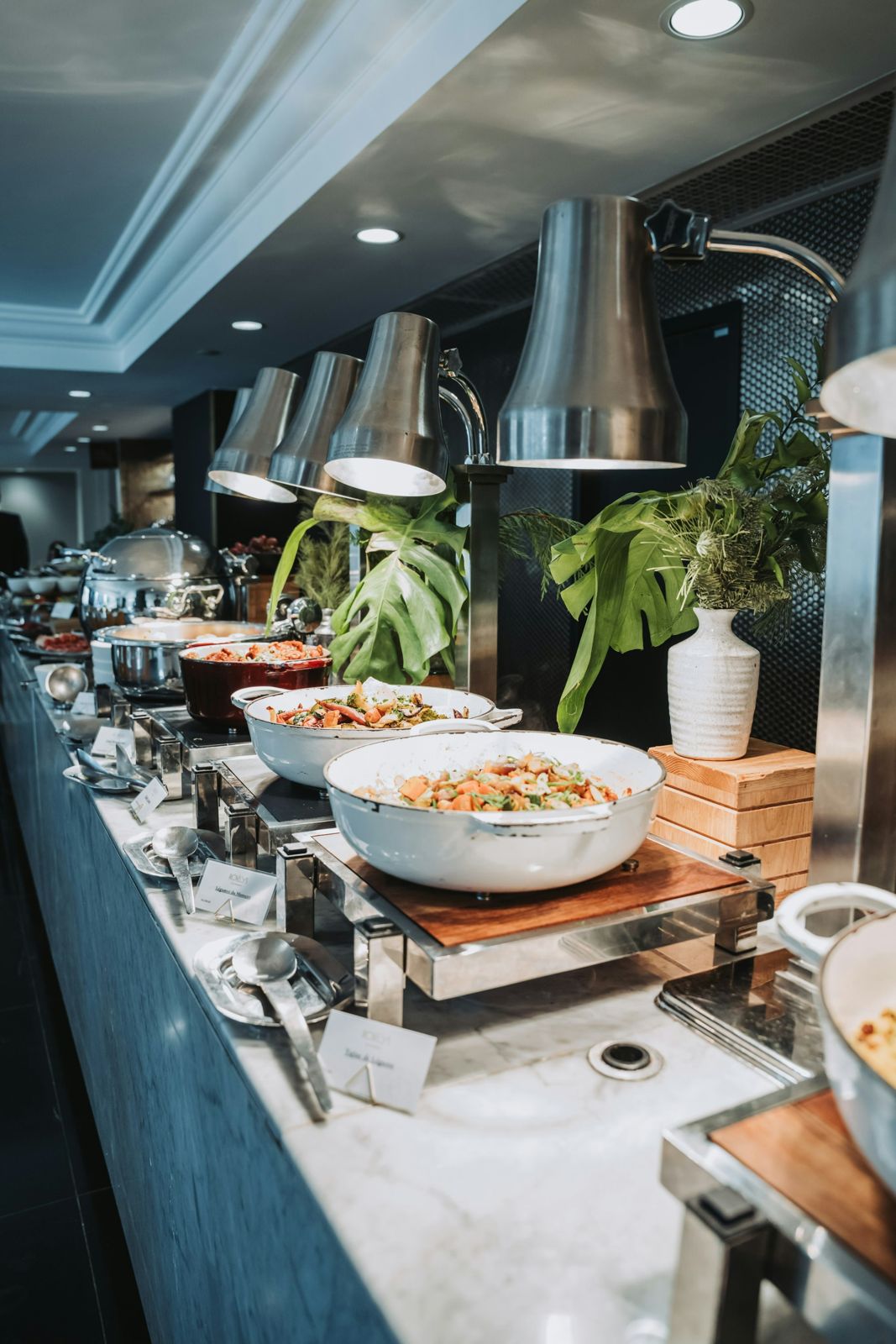 A buffet table set with salads and warm dishes